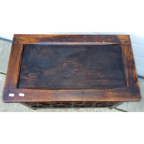 827 - An oak/ply blanket box with carved front, 72cm wide