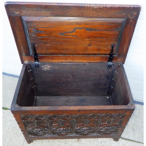 827 - An oak/ply blanket box with carved front, 72cm wide