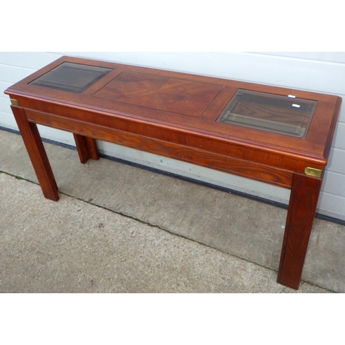 848 - A side table with glass inset top, 133cm long