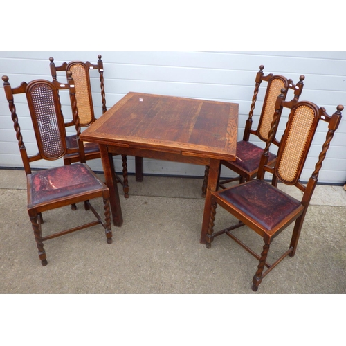 850 - A 1930's oak/ply draw leaf table, legs loose, together with four barleytwist chairs, a/f (5)