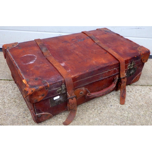 854 - A brown leather suitcase, 67cm wide