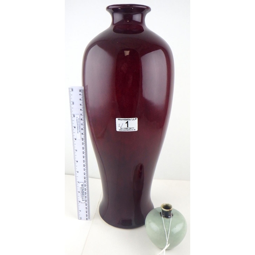 1 - A large Oriental style high fired deep red vase 46cm tall together with a small celadon vase 8cm tal... 