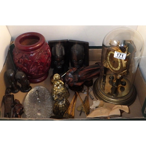 171 - A group of carved wooden African busts, metal bells, glass dome clock etc