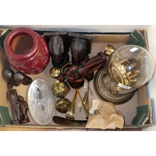 171 - A group of carved wooden African busts, metal bells, glass dome clock etc