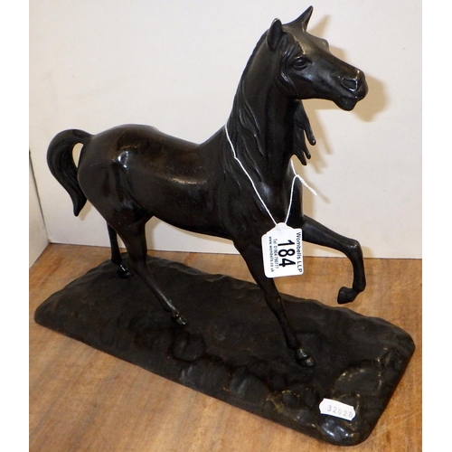 184 - A cast bronze figure of a horse 28cm high