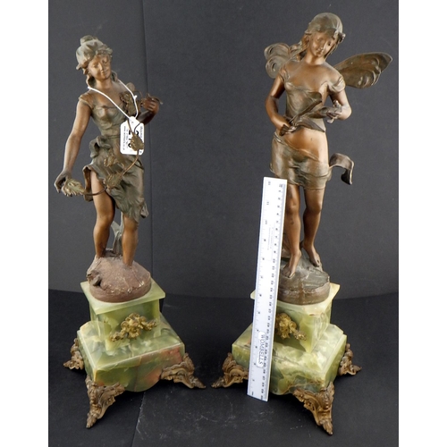 215 - A pair of spelter figures mounted on onyx bases 50cm tall AF