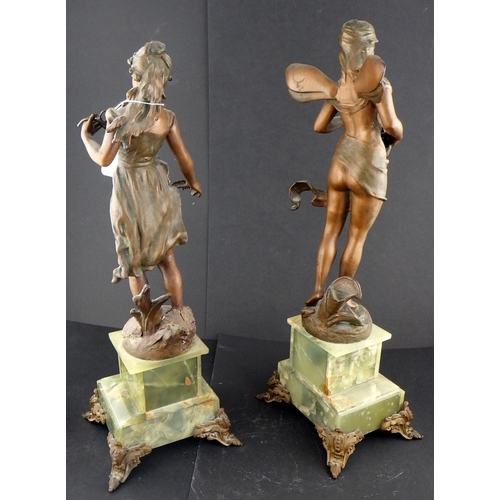 215 - A pair of spelter figures mounted on onyx bases 50cm tall AF