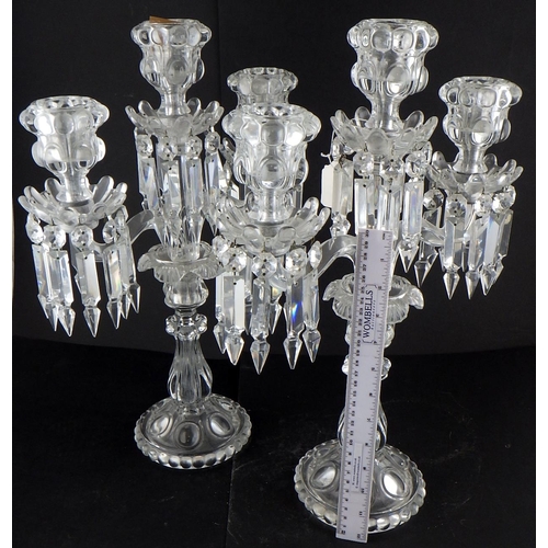 218 - A pair of pressed glass candelabras 46cm tall