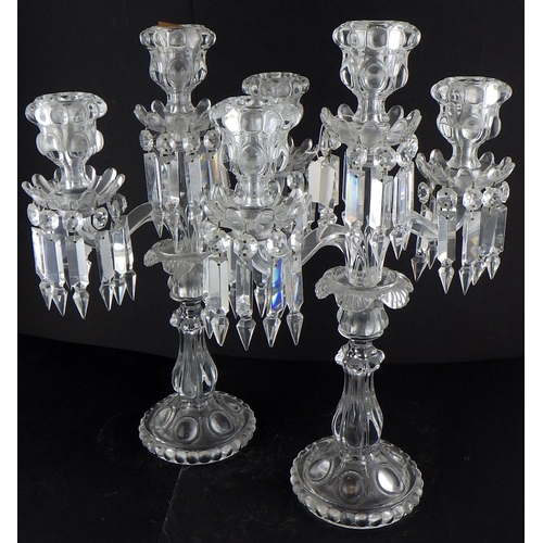 218 - A pair of pressed glass candelabras 46cm tall