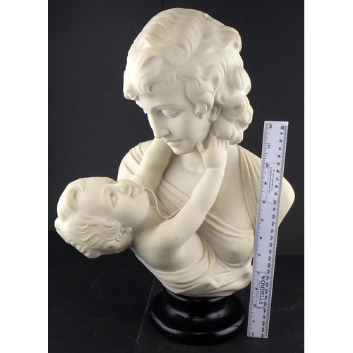 219 - A reconstituted marble bust of a mother and child 44cm tall