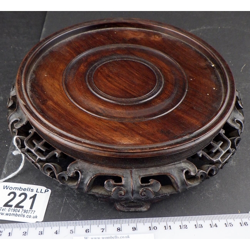 221 - An Oriental hardwood carved stand (14.5cm inner diameter)