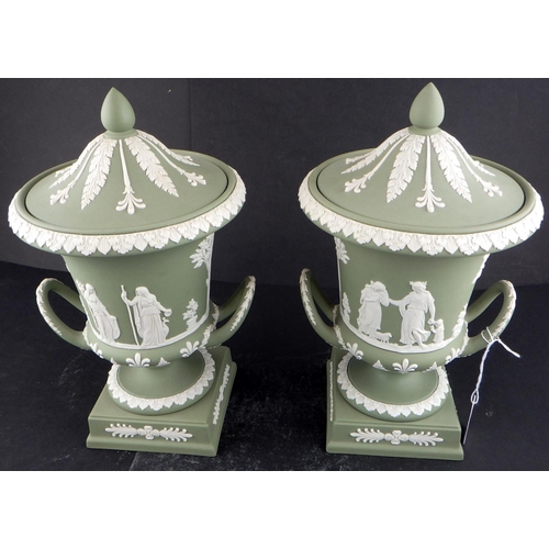 225 - A pair of Wedgwood Sage Green Jasperware twin-handled lidded urns 29cm tall