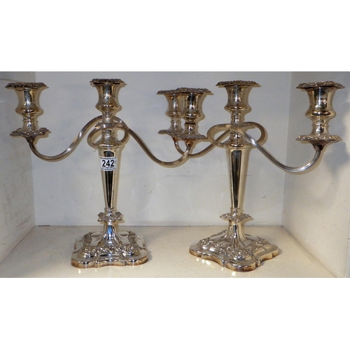 242 - A good pair of silver plated candelabras 32cm tall