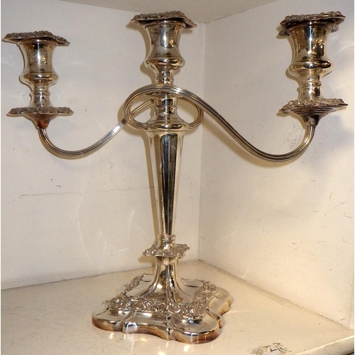 242 - A good pair of silver plated candelabras 32cm tall