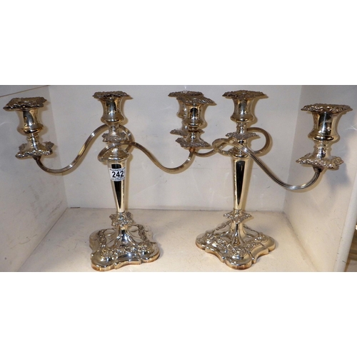 242 - A good pair of silver plated candelabras 32cm tall