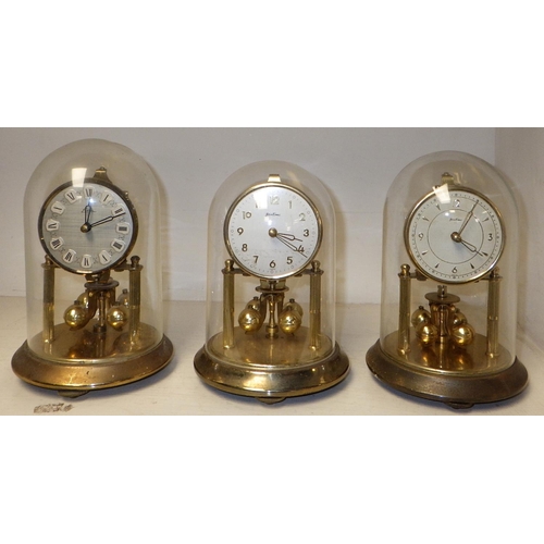 245 - A group of four domed anniversary clocks together with a London Clock Company mantle clock (5)