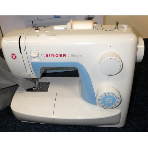 283 - A boxed Singer Simple 3221 electric sewing machine, ALL ELECTRICALS SOLD AS SEEN