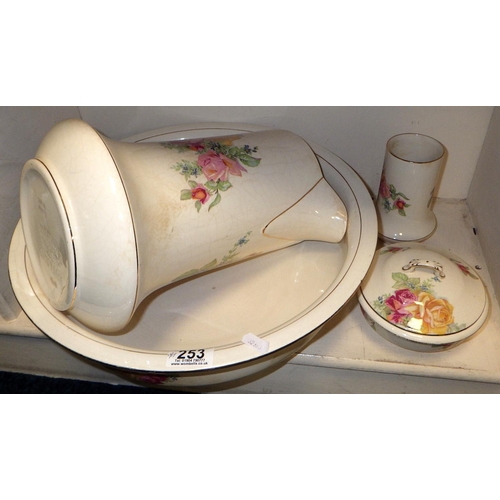 253 - A Falcon ware Jug and bowl set together with a glass dressing table set