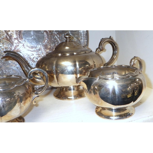 255 - A four piece silver plated tea set together with a circular tray (5)