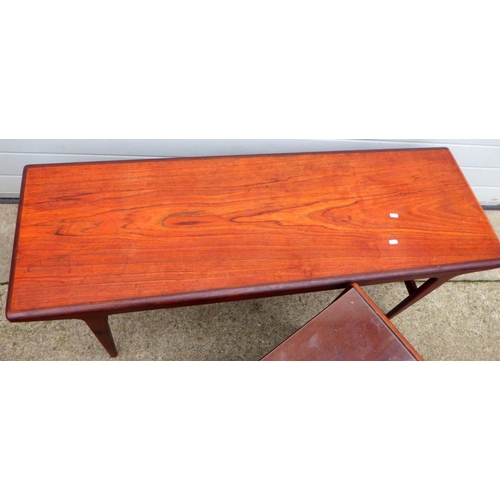 632 - A teak coffee table, missing stretchers, 137cm long together with a nest of occasional tables (2)