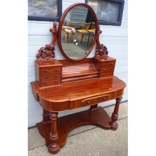 633 - A Victorian mahogany dressing table, 121cm wide, missing correct bolts, holes from removed sconces