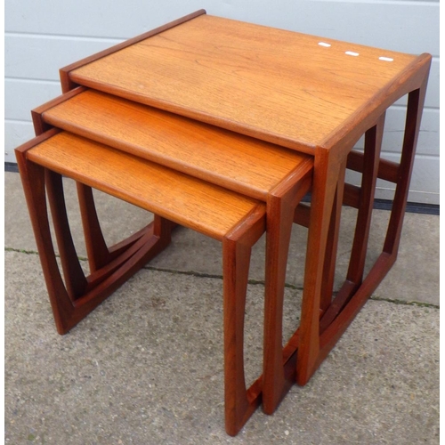 639 - A teak nest of three occasional tables