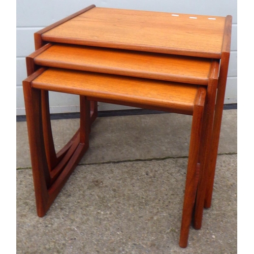 639 - A teak nest of three occasional tables