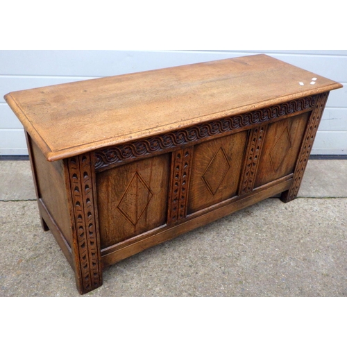 640 - A three panel oak blanket box, 106cm wide