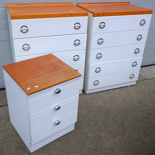 643 - A pair of white chest's of drawers with wooden tops together with another smaller similar chest (3)