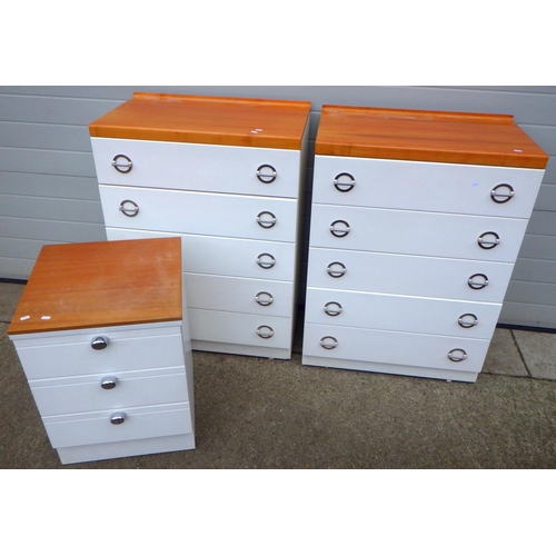 643 - A pair of white chest's of drawers with wooden tops together with another smaller similar chest (3)