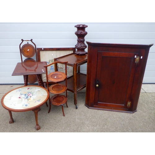 655 - A hanging corner cupboard, two cakestands, trolley, two occasional tables, firescreen, table leg (8)