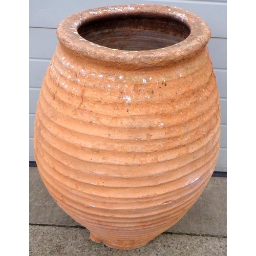 669 - A large Spanish terracotta ribbed pot, 78cm tall