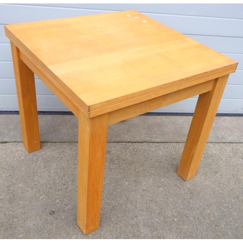 674 - A modern light oak dining table with fold out top, 81cm wide