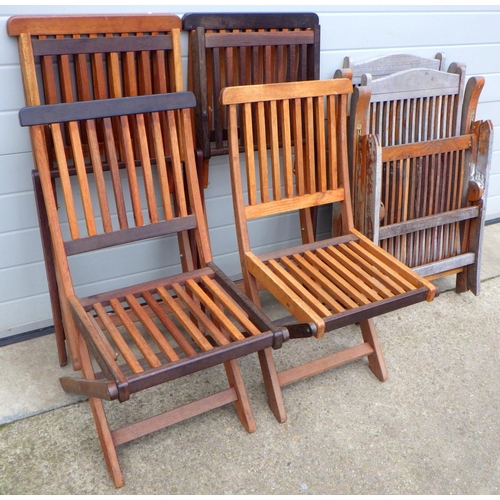 676 - A set of four folding teak garden chairs together with two similar garden armchairs