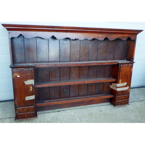 687 - An oak dresser rack, 185cm wide, missing hooks