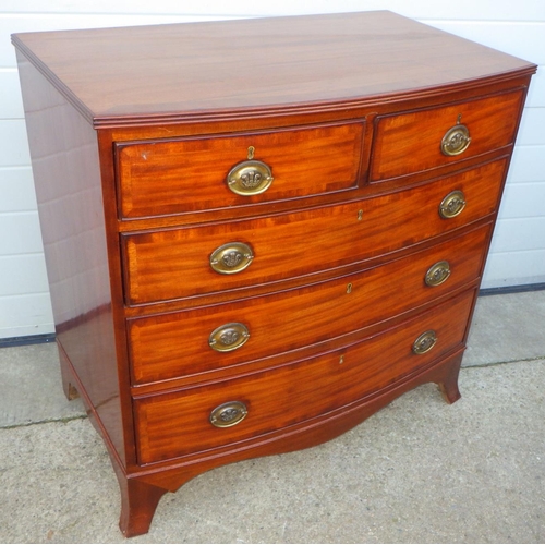 A reproduction mahogany crossbanded bowfronted chest of drawers, 92cm wide
