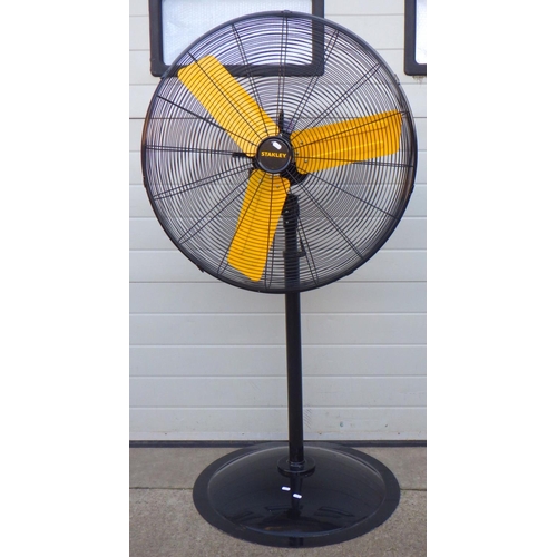 704 - A large Stanley floorstanding fan