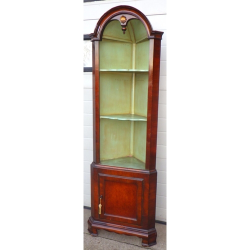 707 - A walnut arched two section open corner cupboard, 184cm tall