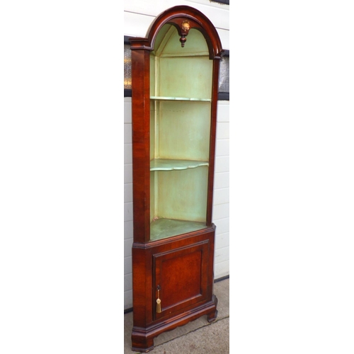 707 - A walnut arched two section open corner cupboard, 184cm tall