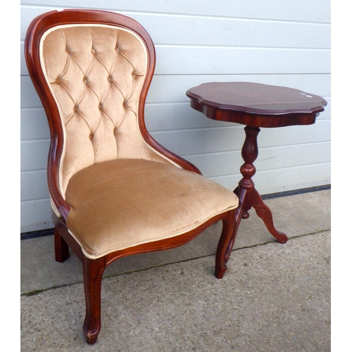 710 - A reproduction nursing chair together with an occasional table (2)