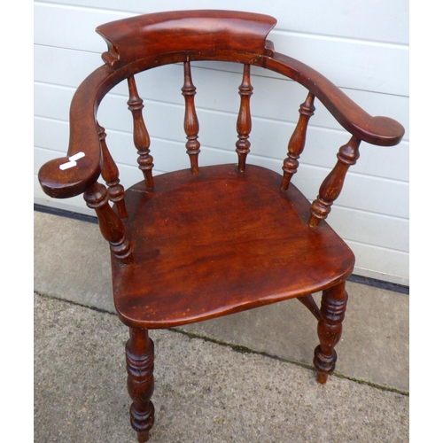 712 - A smokers bow armchair, damage