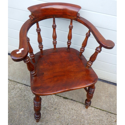 712 - A smokers bow armchair, damage