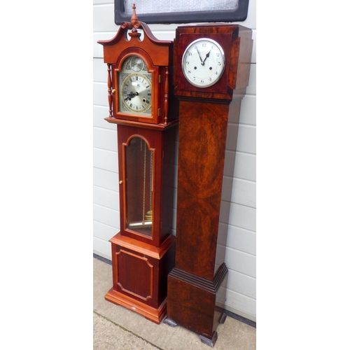 714 - A 1930's walnut Grand daughter clock together with a Tempus Fugit Grand daughter clock (2)