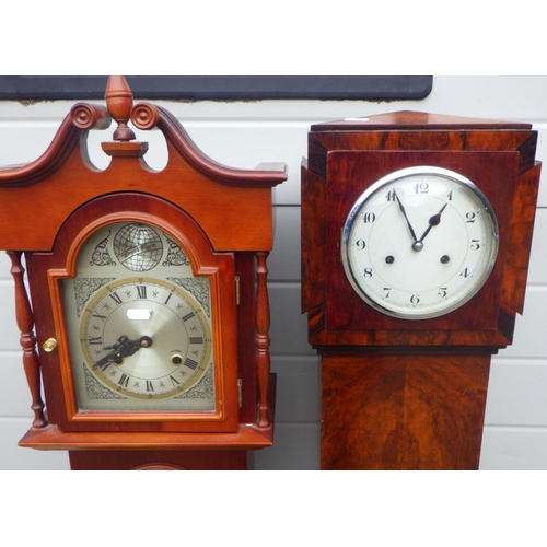 714 - A 1930's walnut Grand daughter clock together with a Tempus Fugit Grand daughter clock (2)