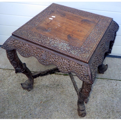 723 - An Eastern carved occasional table, top warped, 61cm wide