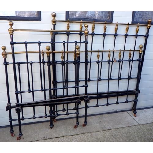 732 - A Victorian brass topped metal bed frame, 134cm wide, together with a similar single bed frame (2)