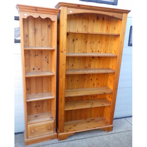 736 - A Ducal pine tall open bookcase, 100cm wide together with a narrow pine bookcase (2)