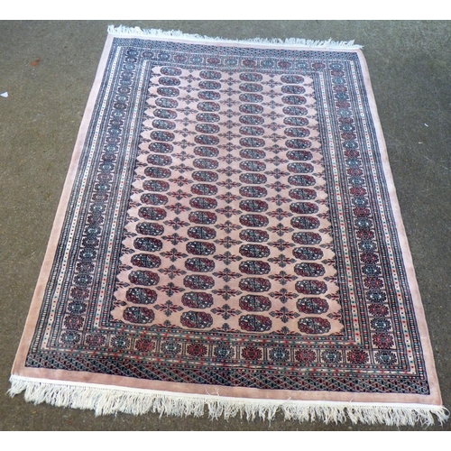 742 - A pink ground rug, 235cm x 169cm