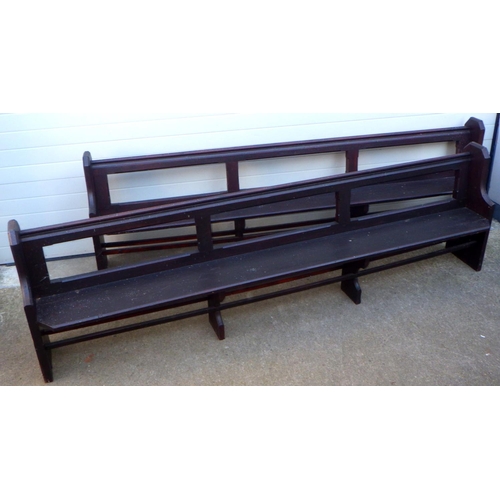 743 - Two Victorian stained pine pews, 296cm long