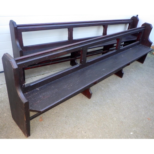 743 - Two Victorian stained pine pews, 296cm long